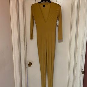 Gold jumpsuit with v cut .New size M